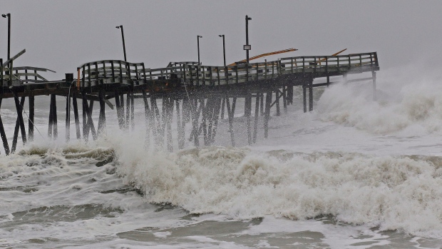 Waves from Hurricane Sandy crash onto the damaged Avalon Pier in Kill Devil Hills, N.C., Monday, Oct. 29, 2012 as Sandy churns up the east coast. (AP / Gerry Broome)