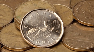 Canadian dollars are pictured in Vancouver, B.C. Thursday, Sept. 22, 2011. THE CANADIAN PRESS/Jonathan Hayward
