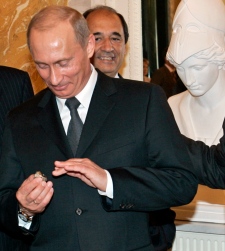 Vladimir Putin holds  2005 Super Bowl ring