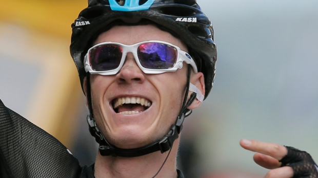 New overall leader Christopher Froome of Britain celebrates as he crosses the finish line to win the eight stage of the Tour de France cycling race over 195 ... - image