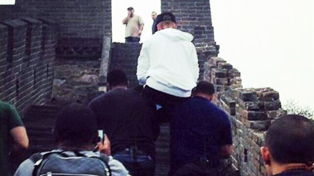 Sleepy Bieber carried up Great Wall of China