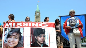 Participants of the Women's Worlds 2011 Congress take part in a rally on Parliament Hill in solidarity with missing and murdered aboriginal women in Ottawa on Tuesday, July 5, 2011. THE CANADIAN PRESS/Sean Kilpatrick