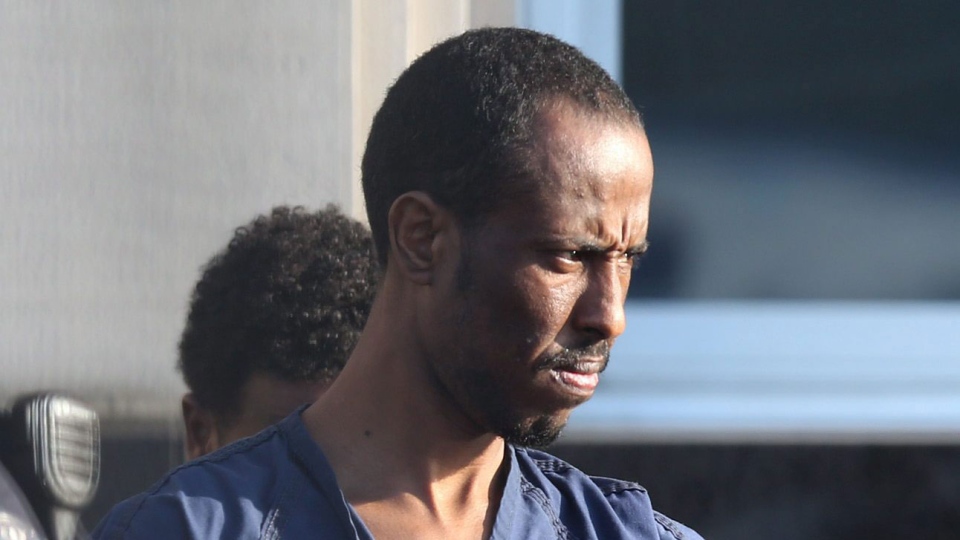 Suspected pirate <b>Ahmed Muse</b> Salad leaves the federal courthouse in Norfolk, <b>...</b> - image