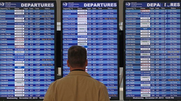 A departures board at Denver International Airport