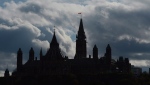 Clouds form a backdrop for the buildings on Parliament Hill in Ottawa on Tuesday, Oct. 22, 2013. (CP / Sean Kilpatrick)