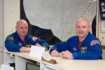Astronauts Mark Kelly, right, STS-124 commander, and Scott Kelly are pictured in the check-out facility at Ellington Field near NASA's Johnson Space Center in Houston in this undated photo provided by NASA. 
