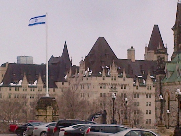 The Israeli flag flying over Parliament Hill