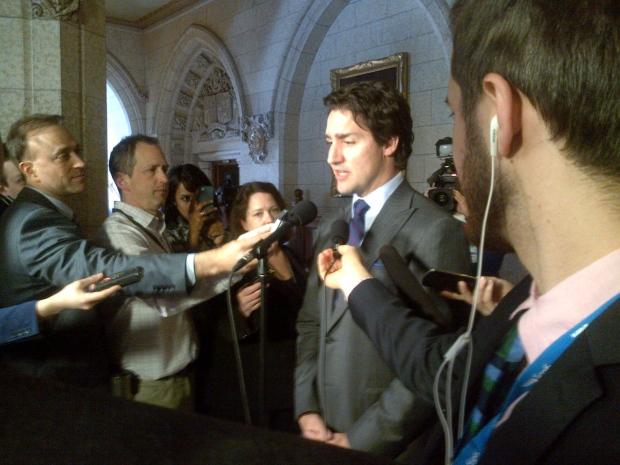 Justin Trudeau speaks in the foyer of the House