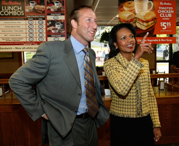 U.S. Secretary of State Condoleezza Rice and Foreign Affairs Minister Peter MacKay order beverages at a Tim Horton's coffee shop in rural Pictou, Nova Scotia on Tuesday, Sept. 12, 2006. (Andrew Vaughan / THE CANADIAN PRESS)