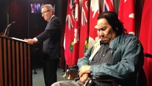 Grassy Narrows Elder Steve Fobister sits next to Ontario Aboriginal Affairs Minister David Zimmer in Toronto on Tuesday, July 29, 2014. (George Stamou / CTV News)