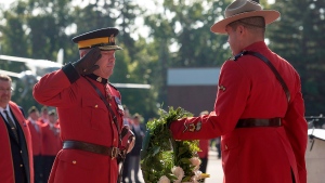 RCMP Commissioner Bob Paulson is presented a wreath at the Cenotaph during the annual RCMP Memorial Service to honour officers who have died in the line of duty at the RCMP Academy, Depot Division in Regina, Sunday, September 14,2014. (Liam Richards / THE CANADIAN PRESS)