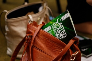 The handbook United Against Terrorism - A Collaborative Effort Towards A Secure, Inclusive and Just Canada sticks out of a purse during a press conference at Winnipeg Central Mosque in Winnipeg, Monday, September 29, 2014. (John Woods / THE CANADIAN PRESS)