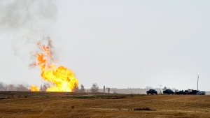 Remaining gas is burned off after explosion and fire at a gas pumping station owned by TransGas near Prud'homme, Sask., Saturday, October 11, 2014. (Liam Richards / THE CANADIAN PRESS)