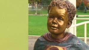 A statue of jeffrey Baldwin dressed as the superhero was unveiled in a Toronto park Saturday, Oct. 18, 2014.
