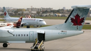 Air Canada planes land at Pierre Elliott Trudeau Airport, in Montreal on Wednesday, Oct. 12, 2011. (Ryan Remiorz / THE CANADIAN PRESS)