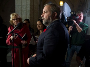 NDP leader Tom Mulcair speaks with reporters following question period in the House of Commons Thursday, October 30, 2014 in Ottawa. (Adrian Wyld / THE CANADIAN PRESS)