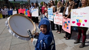 Micheal Sammortuk, 4, of Rankin Inlet joins Inuit youth as they mark world suicide prevention day on Parliament Hill in Ottawa on Monday, Sept. 10, 2012. (Sean Kilpatrick / THE CANADIAN PRESS)