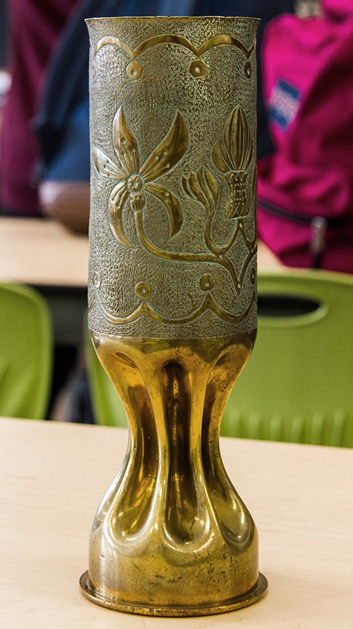 A hundred-year-old artillery shell that a soldier transformed into trench art.