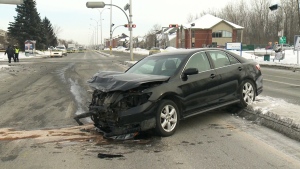 A car is seen following a collision in Longeuil, Que., on Feb. 13, 2014. 