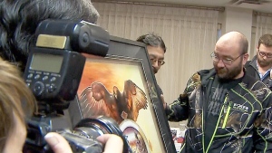 Garden Hill First Nations members present Sean Vincent, one of the men who rescued Rinelle Harper, with a framed picture as thanks.