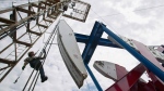 Alberta surplus shrinks as oil prices sag