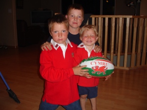Sean, Blake and Lyndon Arnal pose with a rugby ball in this undated family handout photo. (Provided / THE CANADIAN PRESS / Arnal Family)