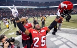 Calgary Stampeders defensive back Keon Raymond celebrates his teams win against the Hamilton Tiger-Cats during the 102nd Grey Cup in Vancouver, B.C. Sunday, Nov. 30, 2014. (Nathan Denette / THE CANADIAN PRESS)