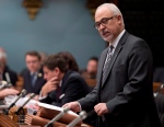 Quebec Finance Minister Carlos Leitao tables a legislation, during question period Thursday, December 4, 2014 at the legislature in Quebec City. (Jacques Boissinot / THE CANADIAN PRESS)