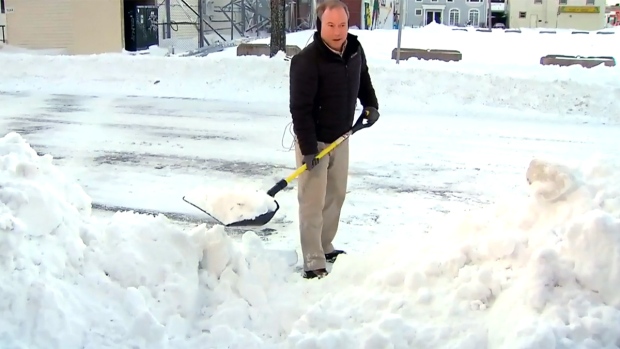 Todd Battis shovels snow on Canada AM