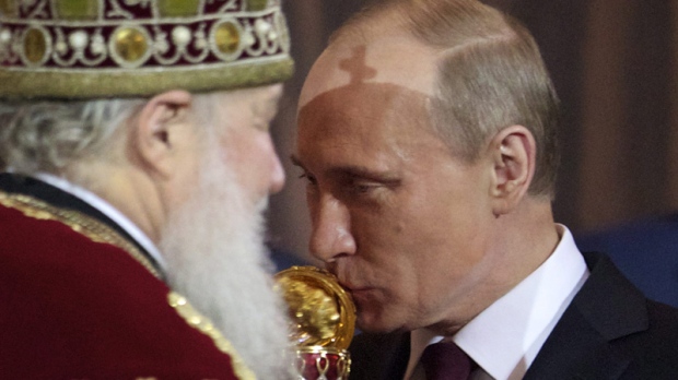Russian Prime Minister and President-elect Vladimir Putin, right, kisses an Easter egg he was presented by Russian Orthodox Patriarch Kirill, left, during the Easter service in the Christ the Saviour Cathedral in Moscow, Russia, Sunday, April 15, 2012. (AP Photo/Ivan Sekretarev)

Read more: http://www.ctvnews.ca/1000s-pray-for-russian-church-mired-in-punk-controversy-1.799748#ixzz2engthj71