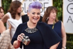 Kelly Osbourne arrives at the 72nd annual Golden Globe Awards at the Beverly Hilton Hotel in Beverly Hills, Calif on Sunday, Jan. 11, 2015. (Invision / John Shearer) 
