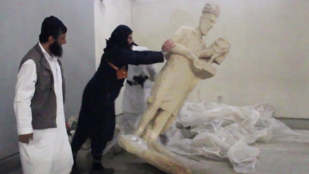 Vandals in the Ninevah Museum in Mosul, Iraq