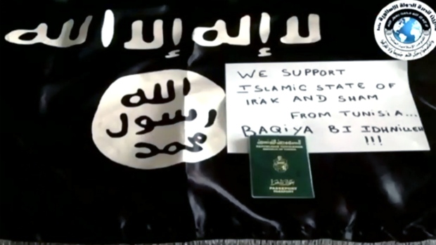 A sign and flag promoting the Islamic State