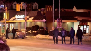 Police attend the scene of a shooting at a McDonald's restaurant near Danforth and Coxwell avenues Saturday February 28, 2015. (John Hanley / CP24)