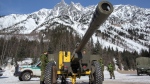 Under the direction of Parks Canada's avalanche forecasters, Canadian soldiers bombard known trigger zones high up on the avalanche paths of Rogers Pass, B.C. as part of the largest mobile avalanche control program in the world.<br><br>Members of the 1st Regiment of the Royal Canadian Horse Artillery (1RCHA) put a 105mm Howitzer in position at Rogers Pass, B.C. on Wednesday, March 4, 2015. (Jeff Bassett / THE CANADIAN PRESS)
