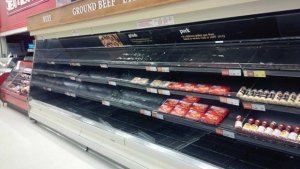 Empty meat shelves are seen at a Dominion supermarket in Gander, N.L., Saturday, March 28, 2015. (Twitter / @CarolynRParsons)