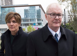 John Furlong and Renee Smith-Valade leave British Columbia's Supreme Court in Vancouver on Monday, March 30, 2015. (Jonathan Hayward / THE CANADIAN PRESS)