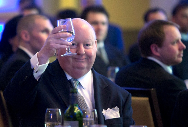 Senator Mike Duffy holds up his glass during the Maritime Energy Association's annual dinner in Halifax on Wednesday, Feb. 6, 2013. (THE CANADIAN PRESS / Devaan Ingraham)