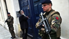 French soldiers guard a Jewish school