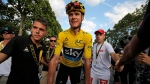 Tour de France champion, Chris Froome, wearing the overall leader's yellow jersey, after finishing the twenty-first stage of the Tour de France cycling race over 113 kilometers (70.2 miles) with start in Chantilly and finish in Paris, France, Sunday, July 24, 2016. (AP / Christophe Ena)