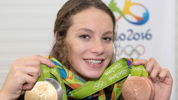 Penny Oleksiak shows off her medals