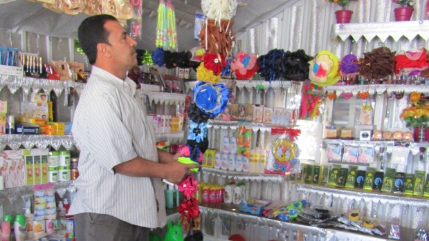 Faisal surveying his accessory shop.