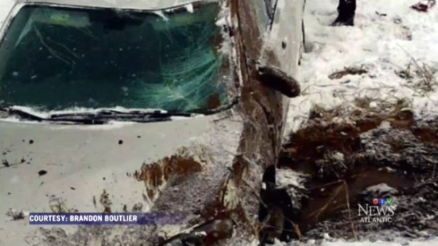 A damaged vehicle on the side of a Nova Scotia hig