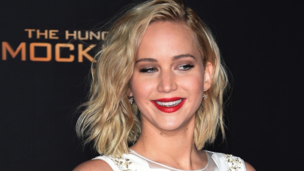 Jennifer Lawrence on red carpet, curly hair