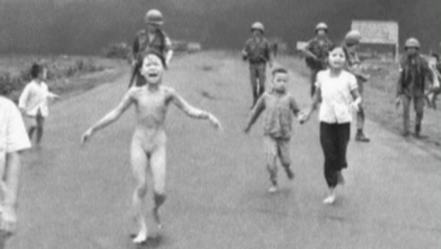Crying children run down Route 1 near Trang Bang, Vietnam after an aerial napalm attack