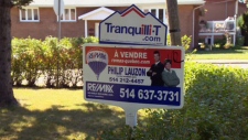 A for sale sign is shown in front of a residence in Montreal, Saturday, Sept. 1, 2012.
