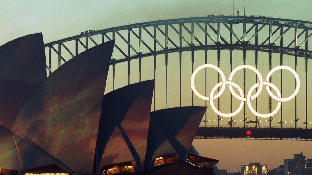 The Olympic Rings glow on the the Sydney Harbour Bridge the day before the opening of the 2000 Olympic Games in Sydney on Sept. 14, 2000. (AP / Rob Griffith)