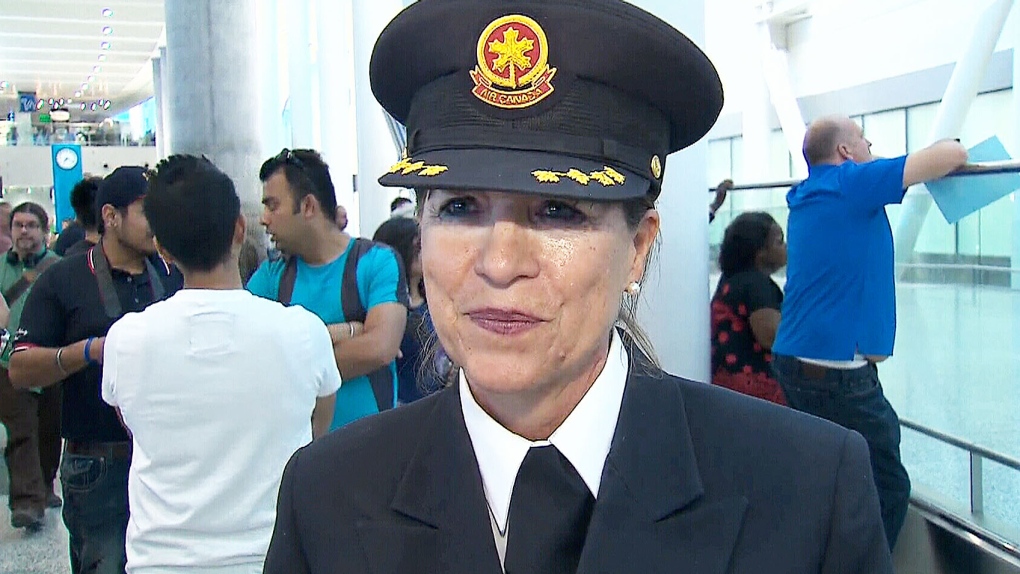 Judy Cameron speaks to reporters after her final flight as an Air Canada pilot on Sunday, May 24, 2015. 