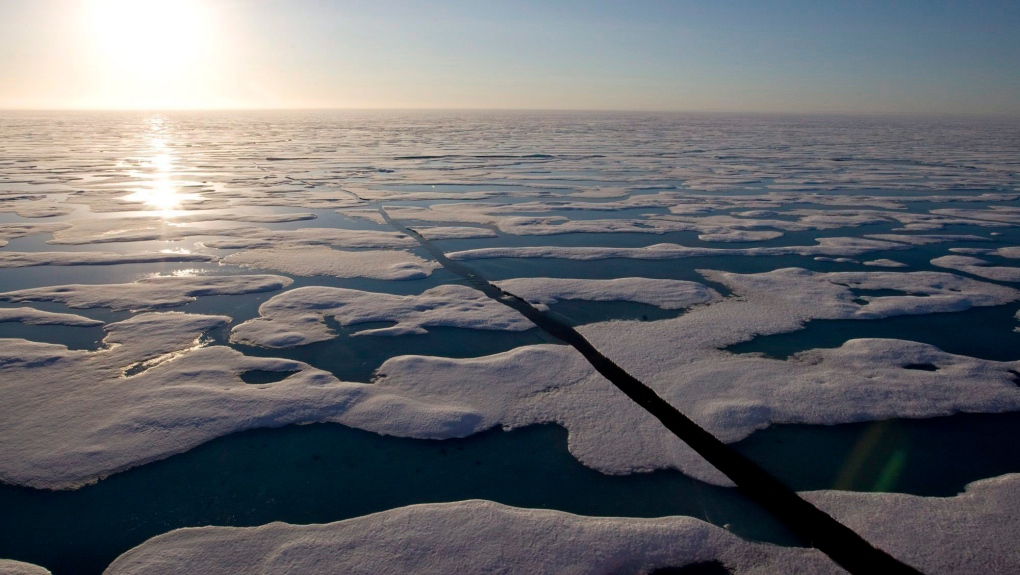 FILE - The midnight sun shines over the ice-covered waters near Resolute Bay at 1:30 a.m. as seen from the Canadian Coast Guard icebreaker Louis S. St-Laurent Saturday, July 12, 2008. (THE CANADIAN PRESS / Jonathan Hayward)