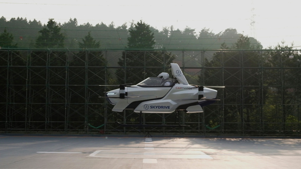 This photo taken at the beginning of August, 2020 and released by SkyDrive / CARTIVATOR 2020, shows a test flight of a manned 'flying car' at Toyota Test Field in Toyota, central Japan. (SkyDrive / CARTIVATOR 2020 via AP)